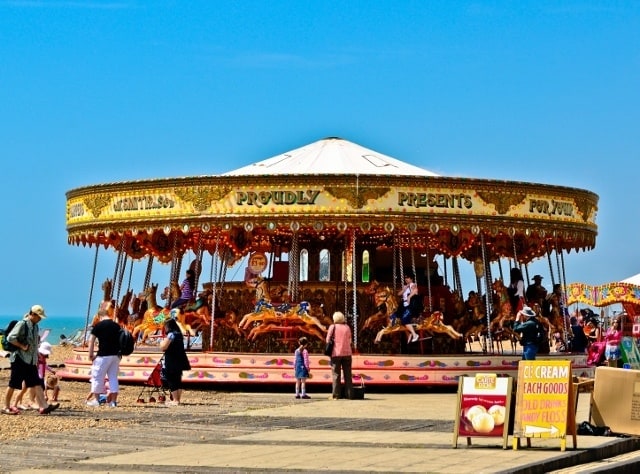 You are currently viewing Grown-up Travel Guide Daily Photo: Beach merry-go-round, Brighton, England