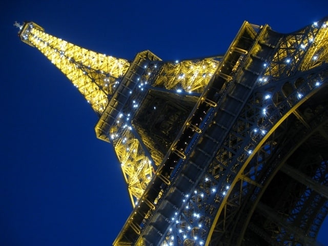 You are currently viewing Grown-up Travel Guide Daily Photo: Eiffel Tower at night (and at quite an angle), Paris, France